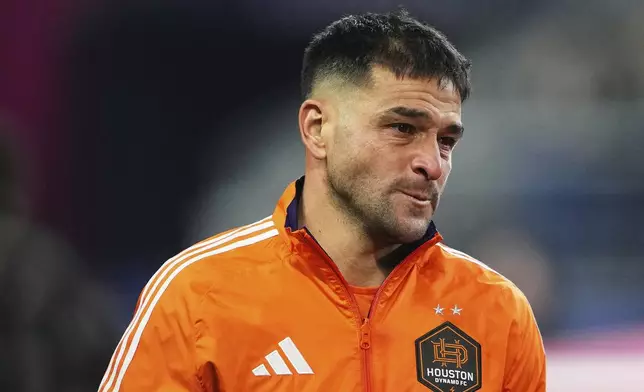 Houston Dynamo midfielder Nicolás Lodeiro becomes emotional after the national anthem before facing his former team, the Seattle Sounders, in an MLS soccer match Saturday, March 22, 2025, in Seattle. (AP Photo/Lindsey Wasson)