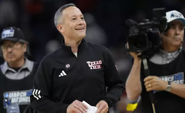 Texas Tech head coach Grant McCasland celebrates after winning in overtime in the Sweet 16 of the NCAA college basketball tournament game against Arkansas, Thursday, March 27, 2025, in San Francisco. (AP Photo/Godofredo A. Vásquez)