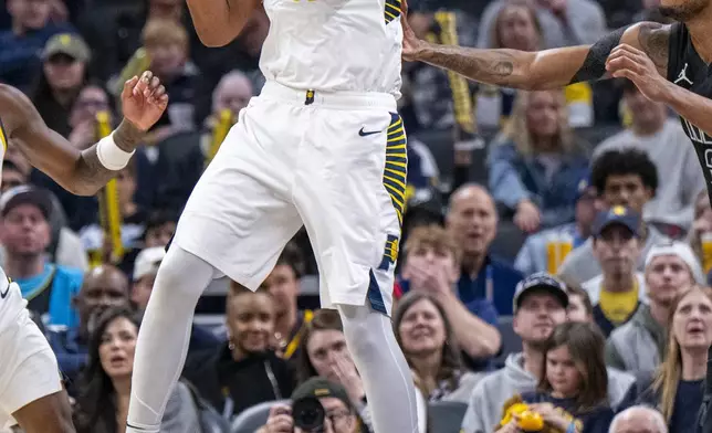 Indiana Pacers center Myles Turner (33) grabs a rebound during the second half of an NBA basketball game against the Brooklyn Nets in Indianapolis, Saturday, March 22, 2025. (AP Photo/Doug McSchooler)