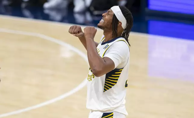 Indiana Pacers center Myles Turner (33) reacts after shooting during the second half of an NBA basketball game against the Brooklyn Nets in Indianapolis, Saturday, March 22, 2025. (AP Photo/Doug McSchooler)