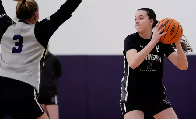Northwestern freshman Kat Righeimer, one of six women from Kobe Bryant’s Mamba Academy going through their first experience with college basketball, works with teammates during NCAA college basketball practice in Evanston, Ill., Tuesday, Feb. 25, 2025. (AP Photo/Nam Y. Huh)