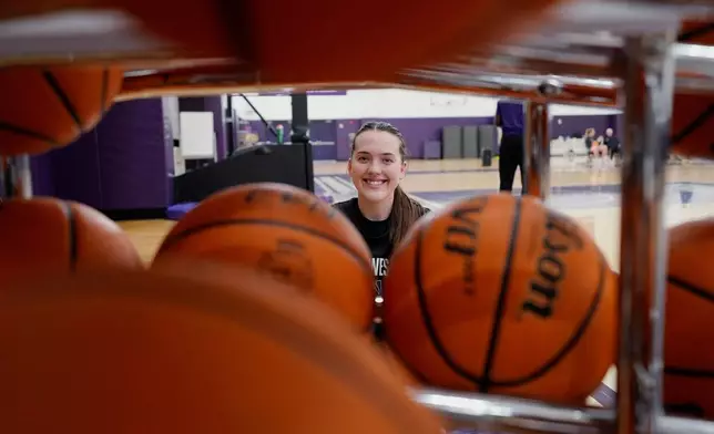 Northwestern freshman Kat Righeimer, one of six women from Kobe Bryant’s Mamba Academy going through their first experience with college basketball, poses for photo during NCAA college basketball practice in Evanston, Ill., Tuesday, Feb. 25, 2025. (AP Photo/Nam Y. Huh)