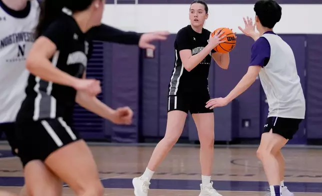 Northwestern freshman Kat Righeimer, one of six women from Kobe Bryant’s Mamba Academy going through their first experience with college basketball, works with teammates during NCAA college basketball practice in Evanston, Ill., Tuesday, Feb. 25, 2025. (AP Photo/Nam Y. Huh)