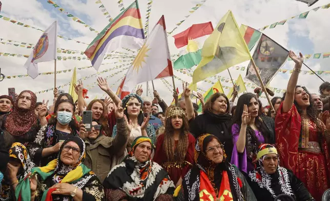 Syrian Kurdish women, most of them wearing traditional clothing, gather to celebrate their Nowruz, Kurdish New Year, in Qamishli, northeastern Syria, Friday March 21, 2025. (AP Photo/Baderkhan Ahmad)