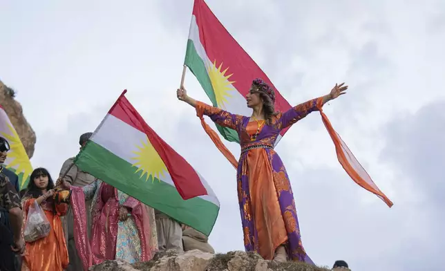 Iraqi Kurds celebrate Nowruz, the Persian New Year, in Akra, Iraq, Thursday, March 20, 2025. (AP Photo/Hadi Mizban)