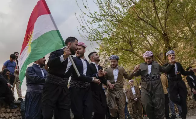 Iraqi Kurds celebrate Nowruz, the Persian New Year, Akra, in Iraq's northern autonomous Kurdish region, Thursday, March 20, 2025. (AP Photo/Hadi Mizban)
