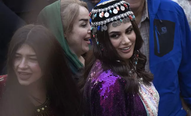 Iraqi Kurds celebrate Nowruz, the Persian New Year, in Akra, Iraq, Thursday, March 20, 2025. (AP Photo/Hadi Mizban)