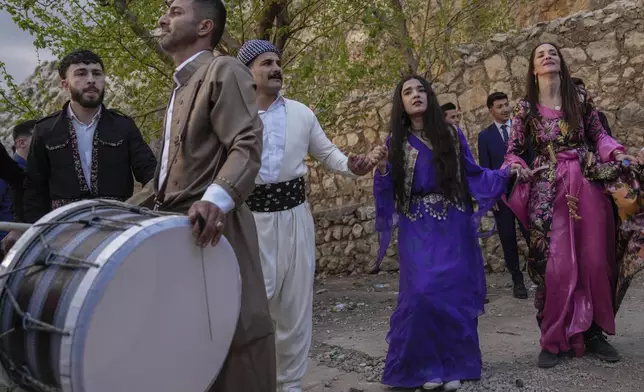 Iraqi Kurds celebrate Nowruz, the Persian New Year, in Akra, in Iraq's northern autonomous Kurdish region, Thursday, March 20, 2025. (AP Photo/Hadi Mizban)