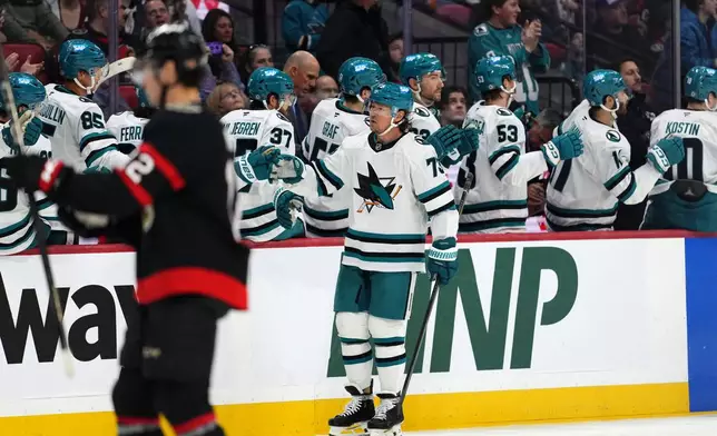 San Jose Sharks' Tyler Toffoli (73) celebrates a goal as Ottawa Senators' Shane Pinto (12) skates away during second period NHL hockey action in Ottawa, on Saturday, March 1, 2025. (Justin Tang/The Canadian Press via AP)