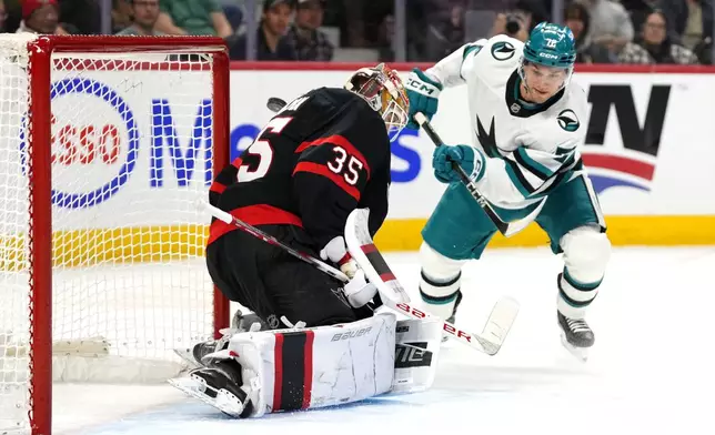 Ottawa Senators goaltender Linus Ullmark (35) makes a save on San Jose Sharks' William Eklund (72) during first period NHL hockey action in Ottawa, on Saturday, March 1, 2025. (Justin Tang/The Canadian Press via AP)