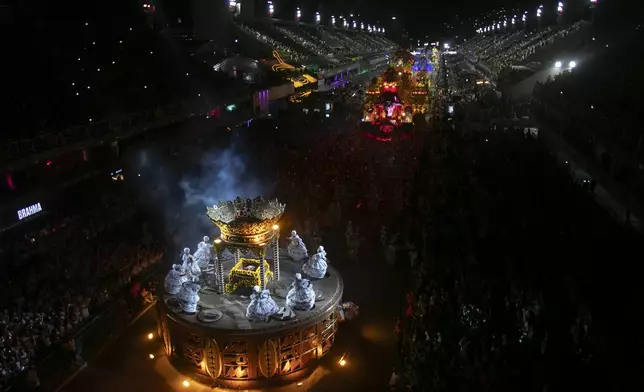Performers from the Unidos de Padre Miguel samba school dance during Carnival celebrations at the Sambadrome in Rio de Janeiro, Sunday, March 2, 2025. (AP Photo/Bruna Prado)