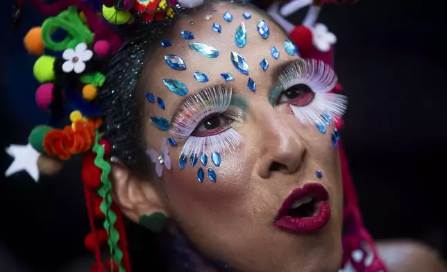 Renata Carvalho sings during the "Cordao do Boitata" street pre-carnival party in Rio de Janeiro, Sunday, Feb. 23, 2025. (AP Photo/Bruna Prado)