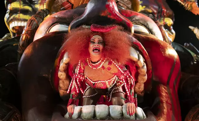 A performer from the Imperatriz Leopoldinense samba school parades on a float during Carnival celebrations at the Sambadrome in Rio de Janeiro, Monday, March 3, 2025. (AP Photo/Bruna Prado)