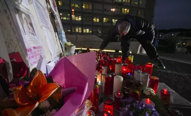Candles for Pope Francis are seen in front of the Agostino Gemelli Polyclinic, in Rome, Friday, March 7, 2025, where the Pontiff is hospitalized since Friday, Feb. 14. (AP Photo/Andrew Medichini)