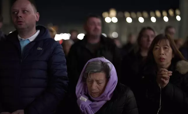 Catholic worshippers pray the Rosary for Pope Francis in St. Peter's Square at The Vatican, Thursday, March 6, 2025. (AP Photo/Francisco Seco)