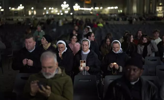 Catholic nuns attend a nightly rosary prayer service for Pope Francis in St. Peter's Square at the Vatican, Thursday, March 6, 2025. (AP Photo/Francisco Seco)