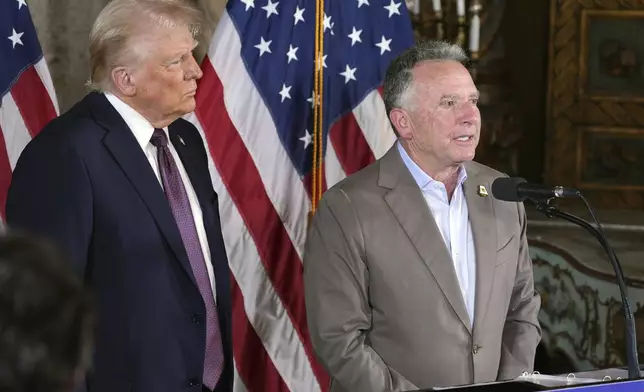FILE - President-elect Donald Trump listens as Steve Witkoff speaks during a news conference at Mar-a-Lago, Jan. 7, 2025, in Palm Beach, Fla. (AP Photo/Evan Vucci, File)
