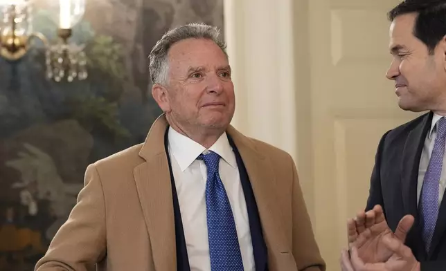 FILE - Steve Witkoff watches as Secretary of State Marco Rubio applauds as President Donald Trump, accompanied by Marc Fogel, speak in the Diplomatic Reception Room at the White House, Feb. 11, 2025, in Washington. (AP Photo/Alex Brandon, File)