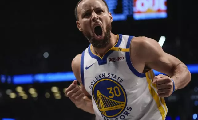 Golden State Warriors' Stephen Curry (30) celebrates after making a three-point shot during the second half of an NBA basketball game against the Brooklyn Nets Thursday, March 6, 2025, in New York. (AP Photo/Frank Franklin II)