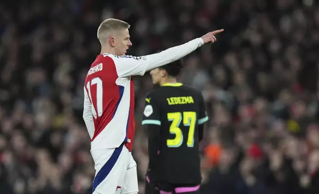 Arsenal's Oleksandr Zinchenko celebrates after scoring his side's opening goal during the Champions League round of 16 second leg soccer match between Arsenal FC and PSV Eindhoven at the Arsenal stadium in London, England, Wednesday, March 12, 2025. (AP Photo/Alastair Grant)