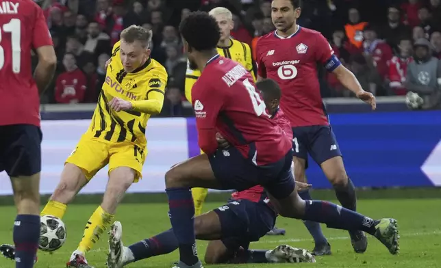 Dortmund's Maximilian Beier scores during the Champions League round of 16 second leg soccer match between Lille and Borussia Dortmund in Villeneuve-d'Ascq , Wednesday, March 12, 2025. (AP Photo/Michel Euler)