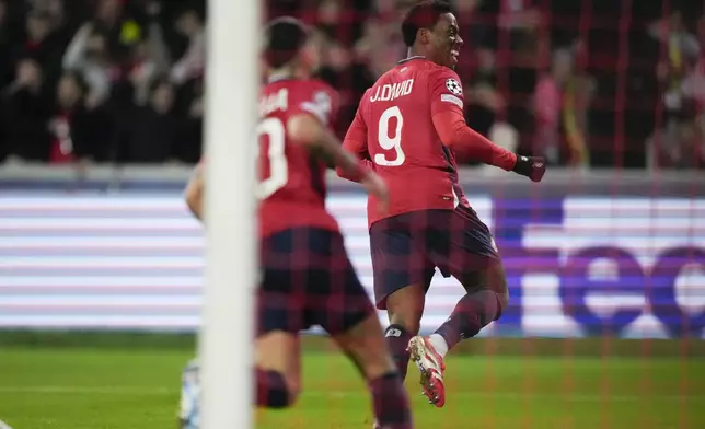 Lille's Jonathan David celebrates after scoring during the Champions League round of 16 second leg soccer match between Lille and Borussia Dortmund in Villeneuve-d'Ascq , Wednesday, March 12, 2025. (AP Photo/Michel Euler)