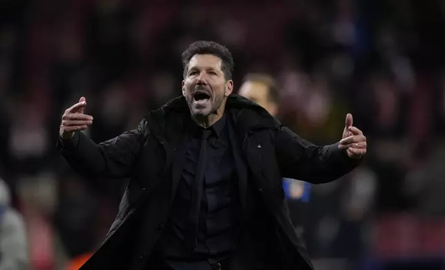 Atletico Madrid's head coach Diego Simeone reacts after losing the penalty shootout during the Champions League round of 16, second leg, soccer match between Atletico Madrid and Real Madrid at the Metropolitano stadium in Madrid, Spain, Wednesday, March 12, 2025. (AP Photo/Bernat Armangue)