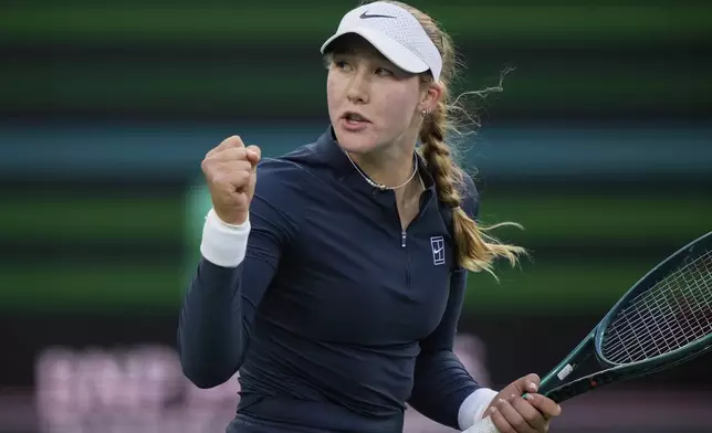 Mirra Andreeva, of Russia, celebrates winning a point against Iga Swiatek, of Poland, during the semifinals at the BNP Paribas Open tennis tournament Friday, March 14, 2025, in Indian Wells, Calif. (AP Photo/Mark J. Terrill)
