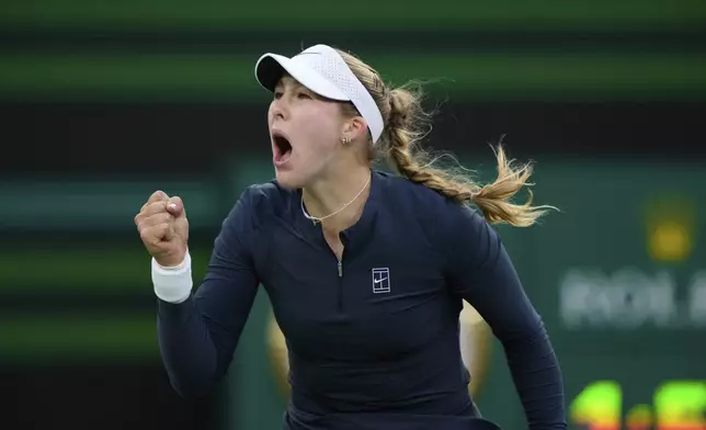Mirra Andreeva, of Russia, celebrates winning a point against Iga Swiatek, of Poland, during the semifinals at the BNP Paribas Open tennis tournament Friday, March 14, 2025, in Indian Wells, Calif. (AP Photo/Mark J. Terrill)