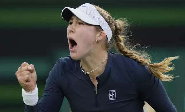 Mirra Andreeva, of Russia, celebrates winning a point against Iga Swiatek, of Poland, during the semifinals at the BNP Paribas Open tennis tournament Friday, March 14, 2025, in Indian Wells, Calif. (AP Photo/Mark J. Terrill)