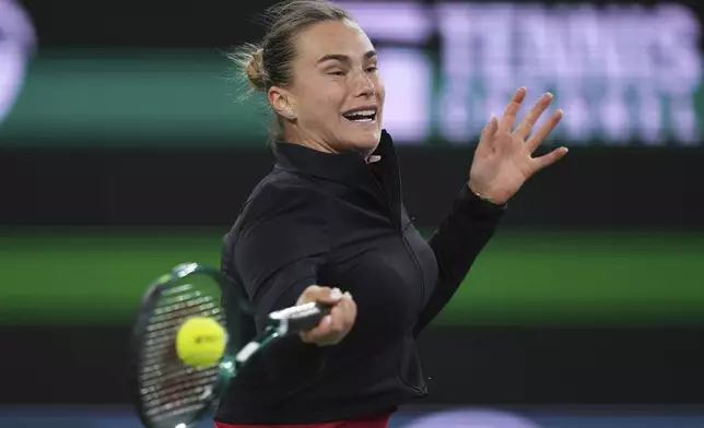 Aryna Sabalenka, of Belarus, returns to Madison Keys, of the United States, during the semifinals at the BNP Paribas Open tennis tournament Friday, March 14, 2025, in Indian Wells, Calif. (AP Photo/Mark J. Terrill)