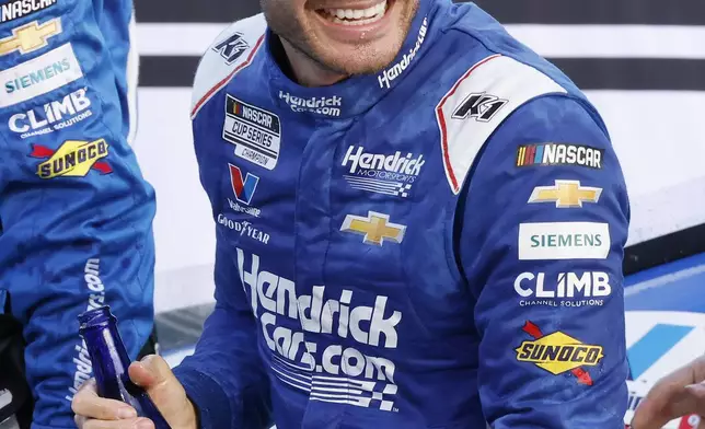 Kyle Larson celebrates in Victory Lane after winning a NASCAR Cup Series auto race at Homestead-Miami Speedway in Homestead, Fla., Sunday, March 23, 2025. (AP Photo/Terry Renna)