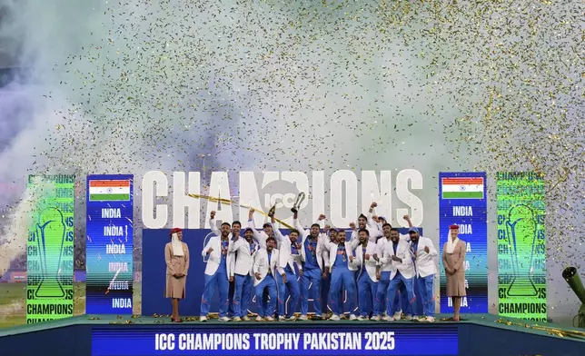 India's players celebrate after winning the ICC Champions Trophy final cricket match against New Zealand at Dubai International Cricket Stadium in Dubai, United Arab Emirates, Sunday, March 9, 2025. (AP Photo/Altaf Qadri)