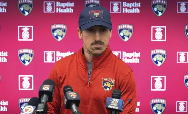 Florida Panthers forward Brad Marchand, who was acquired in a trade by the Panthers from the Boston Bruins last Friday, speaks during a news conference Monday, March 10, 2025, in Fort Lauderdale, Fla. (AP Photo/Lynne Sladky)
