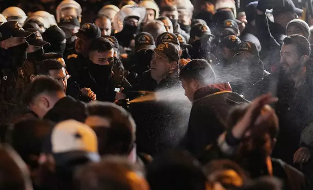 Anti riot police officers use tear gas to clear protesters during a protest against the arrest of Istanbul's Mayor Ekrem Imamoglu, outside Caglayan courthouse, in Istanbul, Turkey, Saturday, March 22, 2025. (AP Photo/Emrah Gurel)