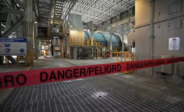 Tape blocks off an area of the Cobre Panamá copper mine, owned by Canada's First Quantum Minerals, in Donoso, Panama, Friday, March 21, 2025, during a press tour of the mine after it was closed by Panama's Supreme Court that ruled the government concession was unconstitutional. (AP Photo/Matias Delacroix)