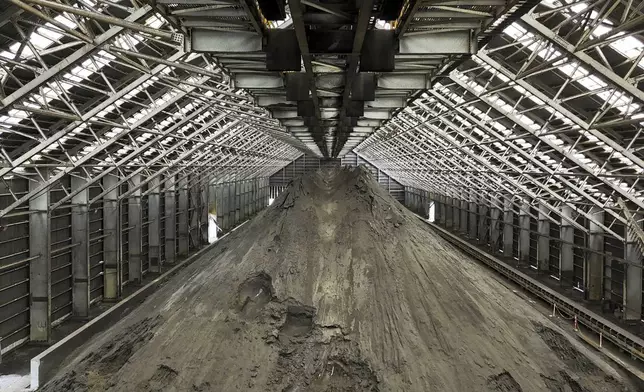 Copper ore piles up at the Cobre Panama copper mine, owned by Canada's First Quantum Minerals, during a media tour of the mine that was closed after Panama's Supreme Court ruled that the government concession was unconstitutional, in Donoso, Panama, Friday, March 21, 2025. (AP Photo/Matias Delacroix)