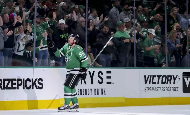 Dallas Stars center Matt Duchene skates toward the punch after scoring in the second period of an NHL hockey game against the Minnesota Wild in Dallas, Monday, March 24, 2025. (AP Photo/Gareth Patterson)