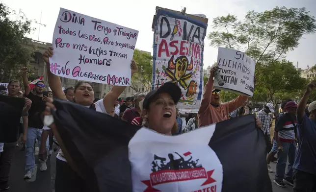 Protesters gather to demand the government provide security against the rising violence in Lima, Peru, Friday, March 21, 2025. (AP Photo/Guadalupe Pardo)
