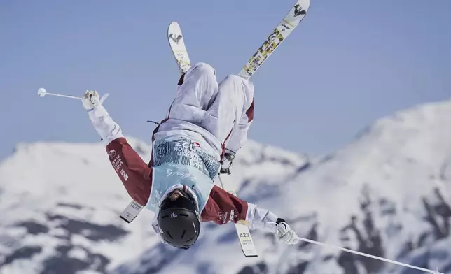 France's Perrine Laffont competes in the women's moguls at the Freestyle World Championships in St. Moritz, Switzerland, Wednesday, March 19, 2025. (Gian Ehrenzeller/Keystone via AP)