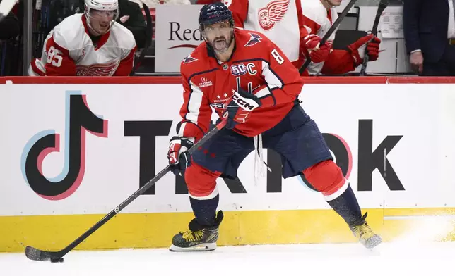 Washington Capitals left wing Alex Ovechkin (8) skates with the puck during the second period of an NHL hockey game against the Detroit Red Wings, Friday, March 7, 2025, in Washington. (AP Photo/Nick Wass)