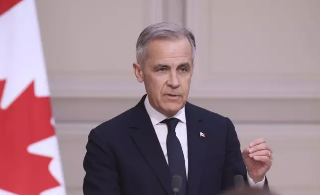 Canada's Prime Minister Mark Carney attends a joint statement with French President Emmanuel Macron Monday, March 17, 2025 at the Elysee Palace in Paris. (AP Photo/Thomas Padilla; Pool)
