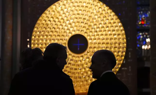 Canada's Prime Minister Mark Carney, right, tours Notre-Dame Cathedral in Paris, Monday, March 17, 2025. (Sean Kilpatrick/The Canadian Press via AP)