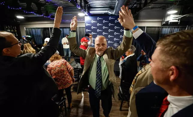 CORRECTS TO FORMER ATTORNEY GENERAL, ADDS CANDIDACY - Former Wisconsin Attorney General and state Supreme Court candidate Brad Schimel greets supporters during a town hall Monday, March 17, 2025, in Oconomowoc, Wis. (AP Photo/Jeffrey Phelps)