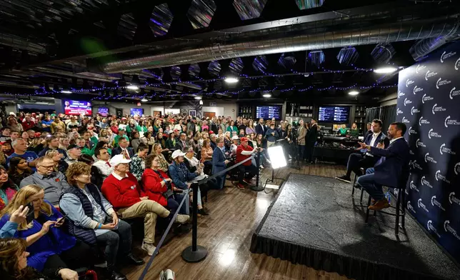Donald Trump Jr. right and Charlie Kirk speak during a town hall meeting Monday, March 17, 2025, in Oconomowoc, Wis. (AP Photo/Jeffrey Phelps)