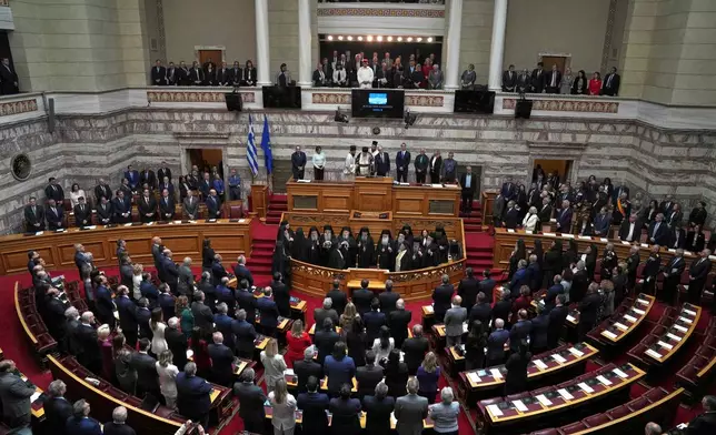 Greece's New President Constantine Tassoulas, top center, takes an oath during the swearing in ceremony at the Parliament, in Athens, Greece, Thursday, March 13, 2025. (AP Photo/Thanassis Stavrakis)