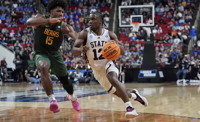 Mississippi State guard Josh Hubbard (12) drives toward the basket past Baylor forward Norchad Omier (15) during the first half in the first round of the NCAA college basketball tournament, Friday, March 21, 2025, in Raleigh, N.C. (AP Photo/Stephanie Scarbrough)