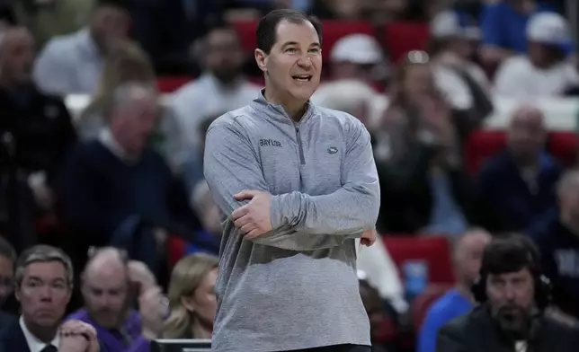 Baylor head coach Scott Drew watches during the first half in the first round of the NCAA college basketball tournament against Mississippi State, Friday, March 21, 2025, in Raleigh, N.C. (AP Photo/Stephanie Scarbrough)