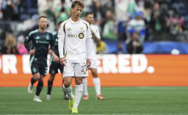 Los Angeles FC forward Nathan Ordaz (27) walks back to midfield after a goal by Seattle Sounders midfielder Cristian Roldan during the second half of an MLS soccer match Saturday, March 8, 2025, in Seattle. (AP Photo/Lindsey Wasson)