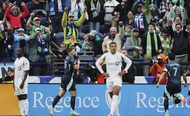 Seattle Sounders forward Jordan Morris, second from left, celebrates his goal against Los Angeles FC with midfielder Cristian Roldan (7) during the second half of an MLS soccer match Saturday, March 8, 2025, in Seattle. (AP Photo/Lindsey Wasson)